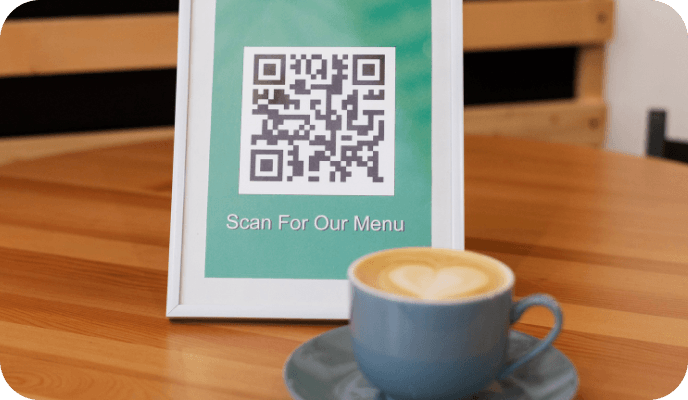 Guest scanning a QR code to open a restaurant menu on a phone
